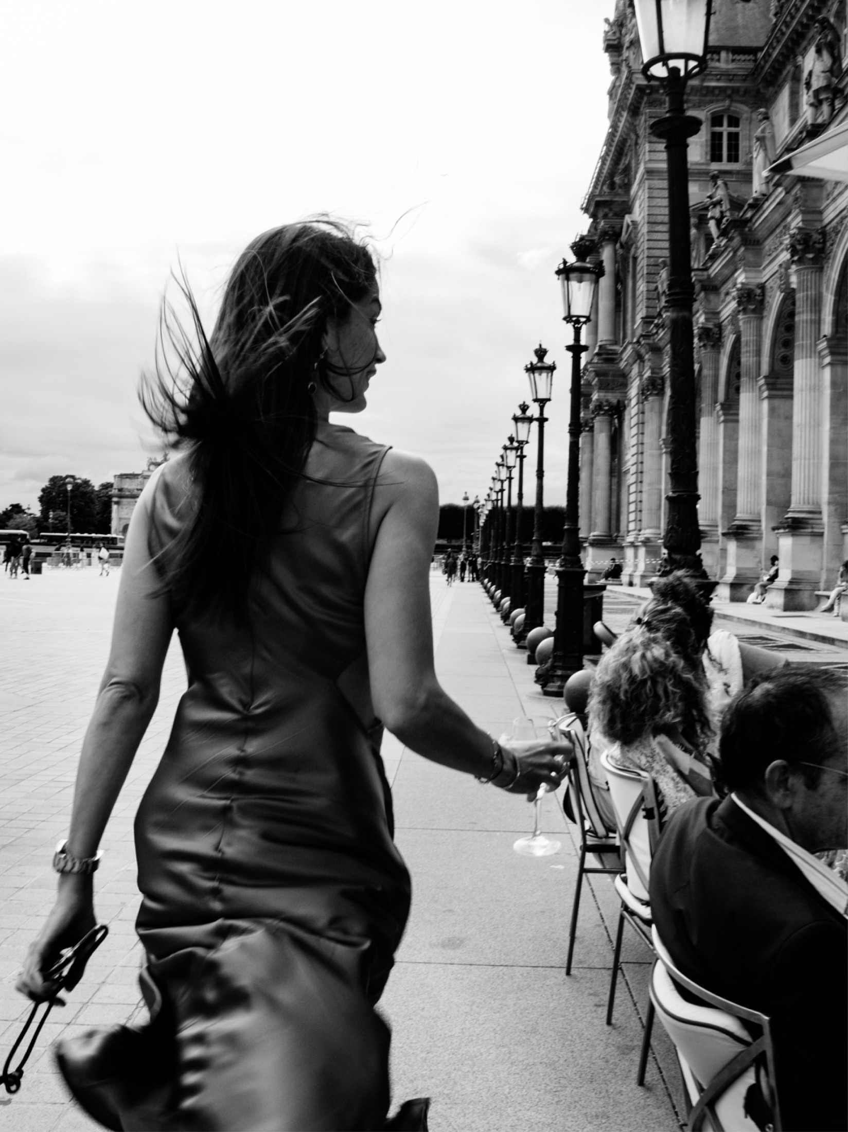 woman having coffee and breakfast in a café louvre paris. The café marly is a luxury café, French restaurant and unusual restaurant.